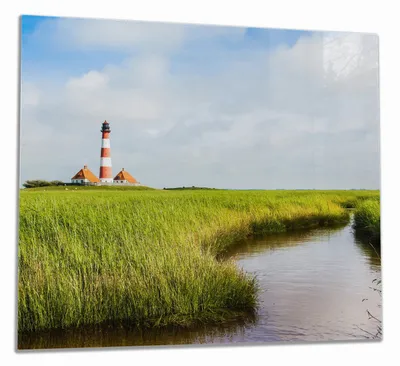 Produktbild von Wallario Herdabdeckplatte aus Glas, Größe 60 x 52 cm 1-teilig, Motiv Kleiner Bach durch Schilf auf dem Weg zum Leuchtturm