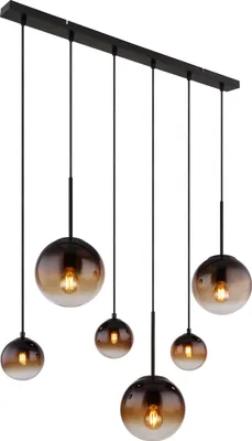 A multi-pendant light fixture with six glass globes hanging from a black bar.