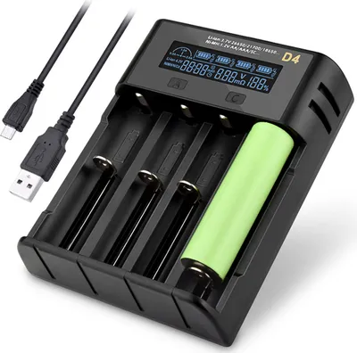 A black battery charger with a green battery inserted, shown on a white background with USB cables.