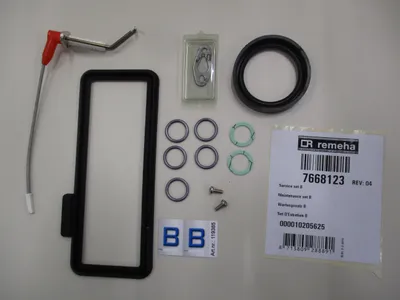 A collection of maintenance parts laid out on a white background.