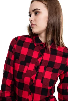 A woman wearing a red and black checkered flannel shirt.