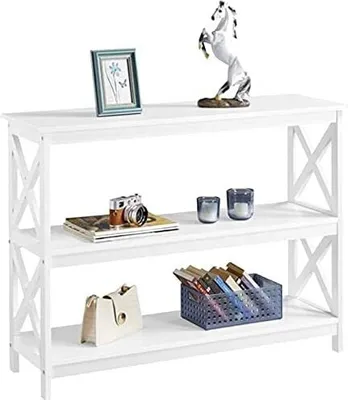 A white three-tiered console table with decorative items on each shelf.