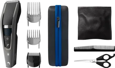 A collection of hair clipper accessories laid out on a white background.