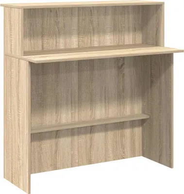 A wooden reception desk with shelves against a white background.