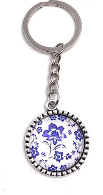 Immagine prodotto di Onwomania cerchio portachiavi con fiori ciondolo in metallo blu scuro