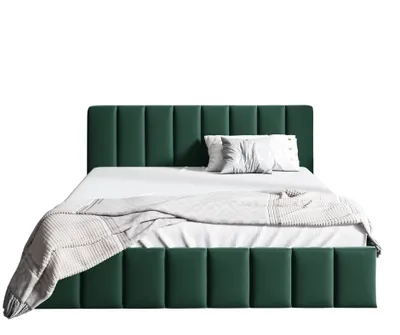 A green upholstered bed with white bedding and two pillows.