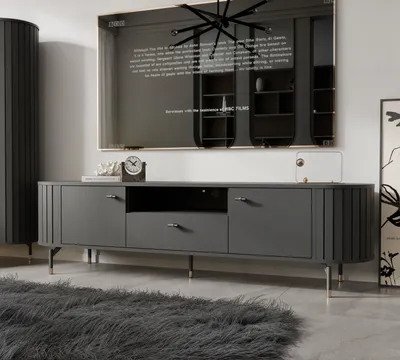 A modern living room setting with a TV stand and a large TV.