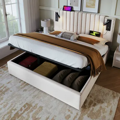 A bedroom scene featuring a bed with storage, bedside lamps, and decorative items.