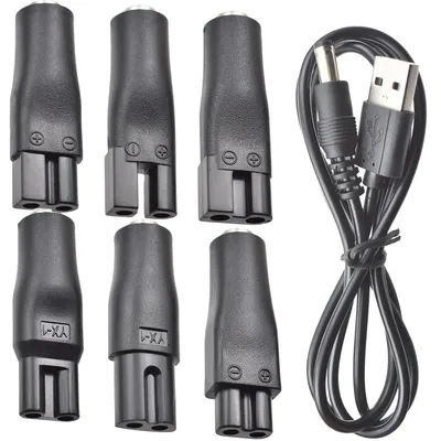 A set of electronic adapters and a USB cable are arranged on a white background.