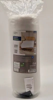 A rolled-up white duvet or comforter is shown inside its clear plastic packaging.