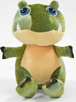 A plush toy dinosaur is sitting and facing the camera.