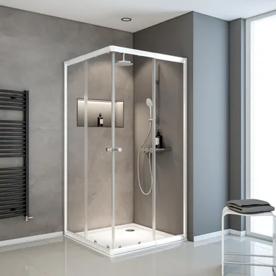 A modern bathroom with a glass shower enclosure.