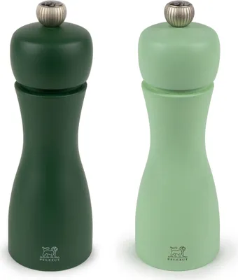 Two wooden pepper mills, one dark green and one light green, are shown against a white background.