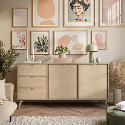 A stylish living room with a sideboard, artwork, and decorative items.