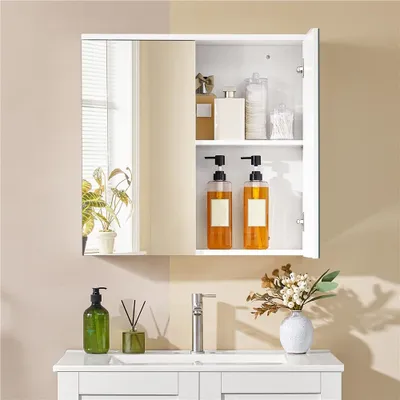 A bathroom cabinet with mirrored doors, displaying various toiletries and decorative items.