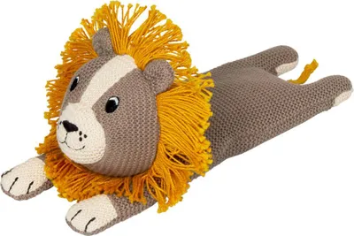 A knitted lion toy lying down on a white background.