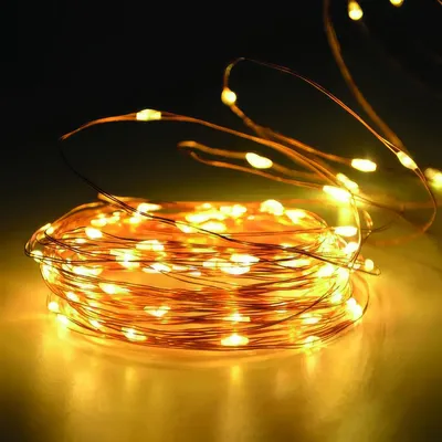 Immagine prodotto di Luci fiabesche a LED MicroLED - Bianco caldo - 10 M di luci fiabesche con 100 LED - Funzionamento a batteria con 2 X AA - Filo sottile flessibile - Per uso interno - Illuminazione d'atmosfera [59765].