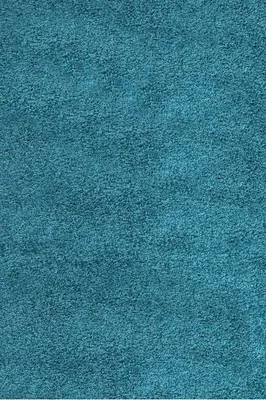 A close-up, full-frame shot of a turquoise rug.