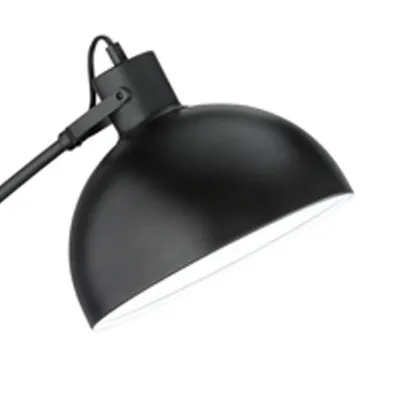 A close-up shot of a black desk lamp's shade and arm.