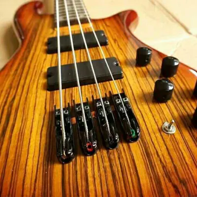 Image de 4 pièces de chevalet de guitare basse, sillets individuels de cordier, compatibles avec 4 accessoires électriques