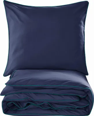A folded duvet and a pillow, both dark blue with teal trim, are shown against a white background.