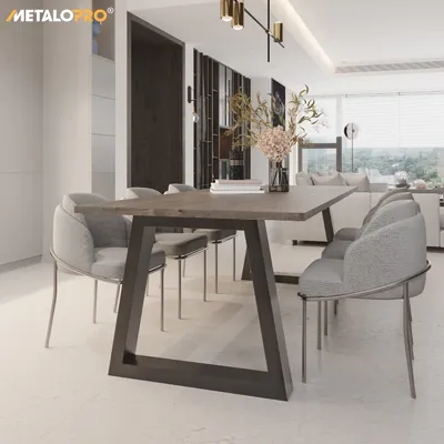 A modern dining room with a table and chairs.