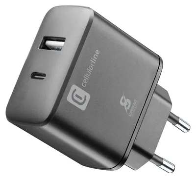 A close-up, angled view of a gray dual-port travel charger with a USB-A and a USB-C port.
