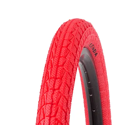 A close-up of a red bicycle tire with a black rim.
