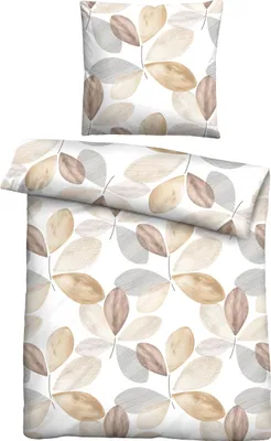 A pillow and a folded duvet cover with a leaf pattern.