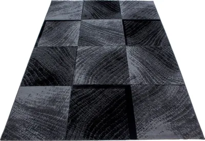 A rug with a wood grain pattern is shown from a diagonal angle on a white background.