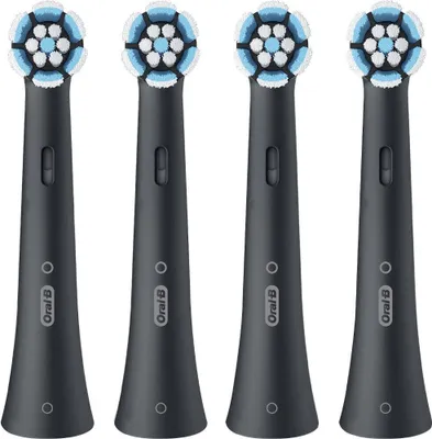 Four black Oral-B iO toothbrush heads are arranged in a row against a white background.