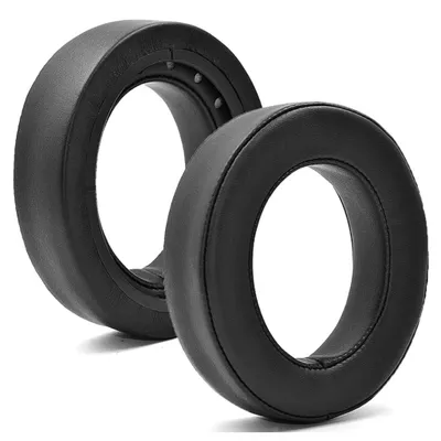 Two black ear pads for headphones are shown against a white background.