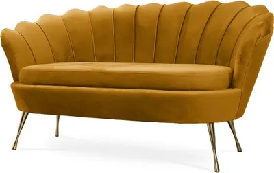 A studio shot of a yellow velvet sofa with a shell-shaped back and metal legs.