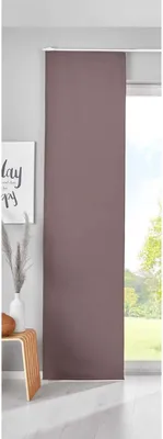 A taupe sliding curtain panel is shown hanging in front of a window, with a small wooden stool and a vase with dried grass to the left.