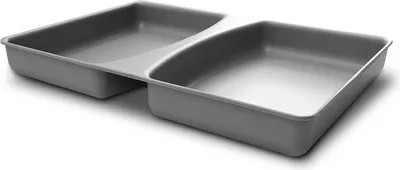 A gray, two-compartment tray on a white background.