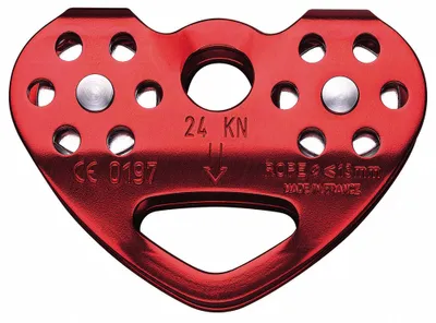 A red climbing pulley on a white background.