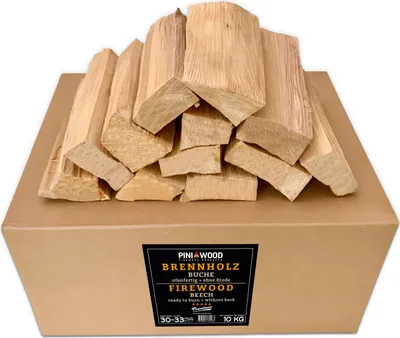 A cardboard box filled with firewood, with a label on the front.