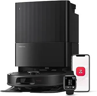 A black robot vacuum cleaner with its charging dock and two smart devices (a smartphone and a smartwatch) are displayed against a white background.