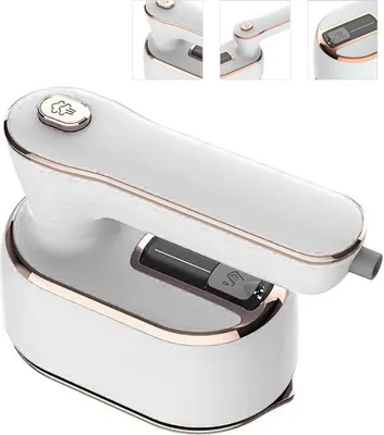 A white and gold portable steam iron is shown from a low angle.