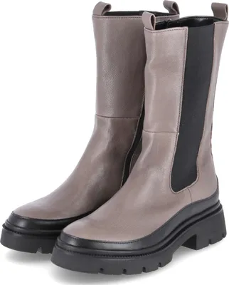 A pair of beige and black women's boots.