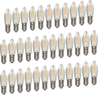 A collection of LED filament light bulbs arranged in rows.