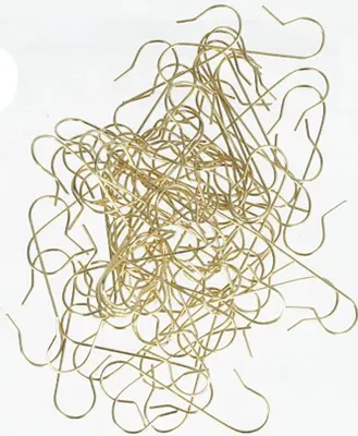 A pile of gold-colored ornament hooks against a white background.