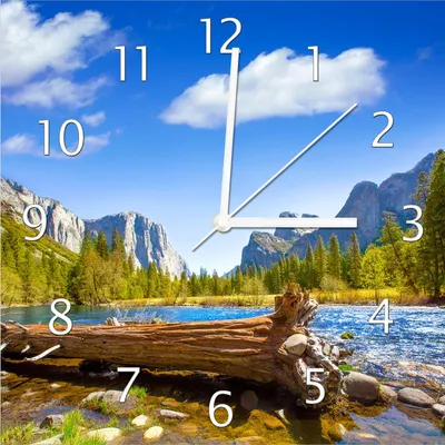 Produktbild von Wallario Design Wanduhr Baumstamm im Fluss zwischen Bergen und Wäldern aus Echtglas, Größe 30 x 30 cm