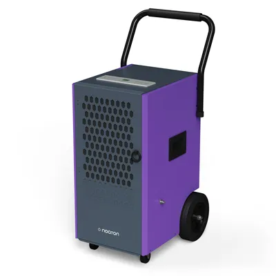 A studio shot of a purple and gray industrial dehumidifier with black wheels and a black handle, set against a white background.