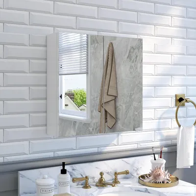 A bathroom cabinet with a mirror is shown mounted on a tiled wall above a marble countertop with a sink and faucet.