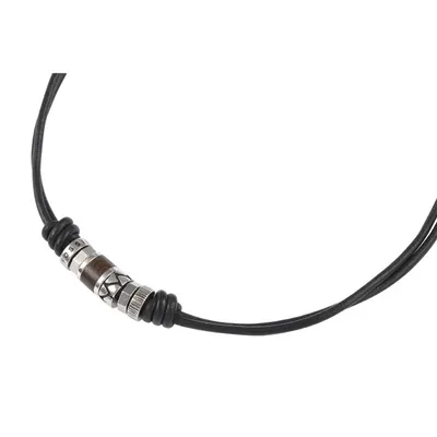 A close-up shot of a necklace with a pendant.