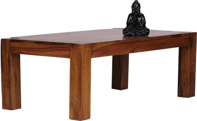 A wooden coffee table with a Buddha statue on top, isolated on a white background.