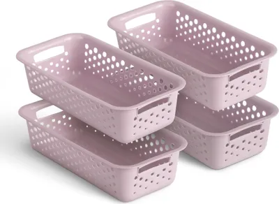 Four pink storage baskets are stacked and arranged in a way that shows their shape and perforated design.