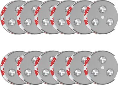 A set of 12 magnetic mounts for smoke detectors, arranged in two rows of six.