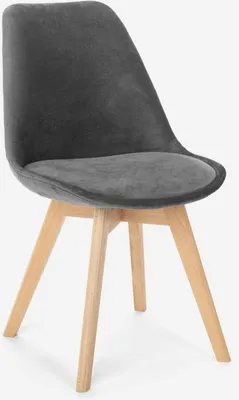 A single gray velvet chair with wooden legs against a white background.